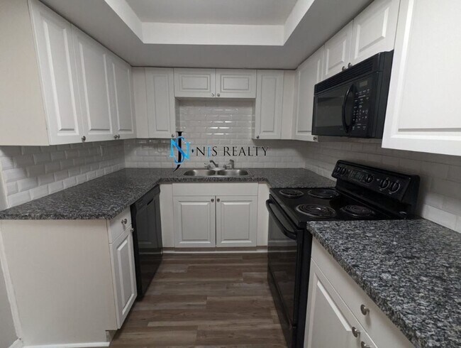 Building Photo - Just Reduced!  2/2/1 with  RENOVATED baths & kitchen, fenced yard, NEW lvp flooring and a OVERSIZ...