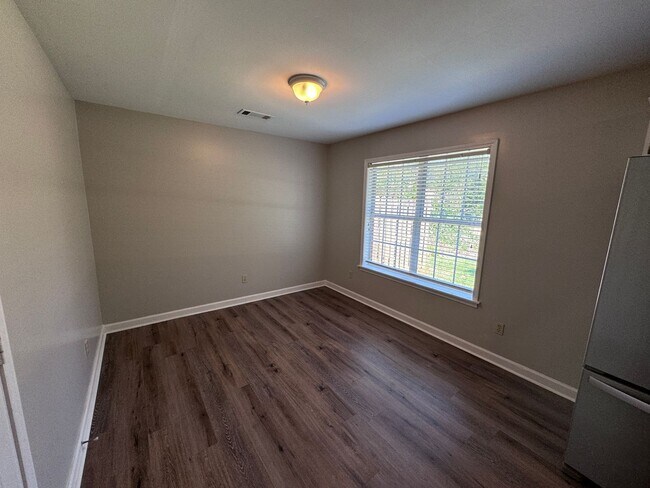 Building Photo - Quiet 3/2 Home with attached garage and fenced yard