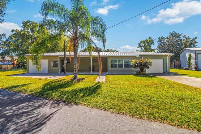 Building Photo - Charming 2BR/2BA Waterfront Home for Rent with Canal Access & Two Garages