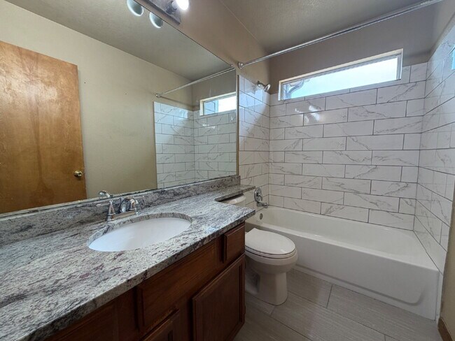 Building Photo - ~Available Now~  Beautiful Four Bedroom Home with Fireplace, Private Yard & Luxurious Primary Suite!
