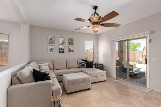 Comfy sectional. Chair and rug added. View to pool.. - 14853 N 173rd Dr