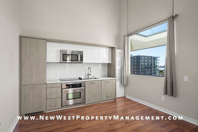 Building Photo - Views, Views, Views! Stunning Top-Floor Little Italy 2-bedroom Loft at The Waterfront!