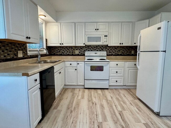 Building Photo - {6617} Move in ready + Updated + Attached Garage