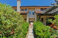Building Photo - PRIME POOLFRONT LOCATION & CLOSE TO MAIN GATE! BRIGHT & SPACIOUS, END-UNIT POOLFRONT TOWNHOUSE W/...