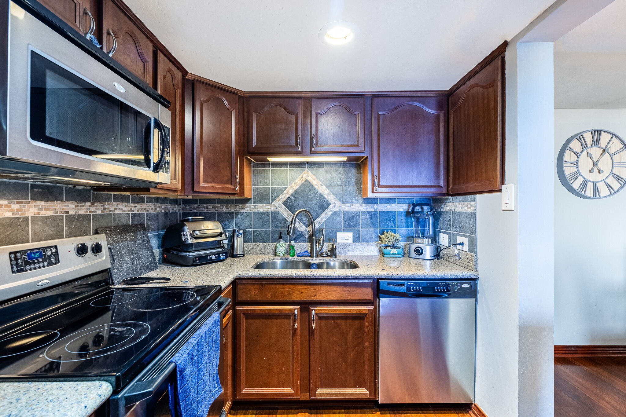 Fully equipped kitchen with bar leading to dining room, even includes spices - 2016 Main St