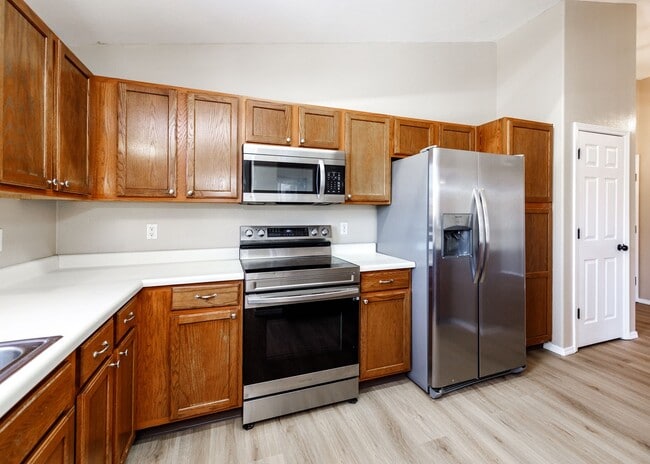 Building Photo - 3 Bed Top Floor Condo near Ft. Carson in Gated Community with detached Garage