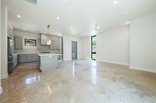Building Photo - Luxury Redefined: Experience Vibrant Living in this 3-Bedroom Haven in East Austin