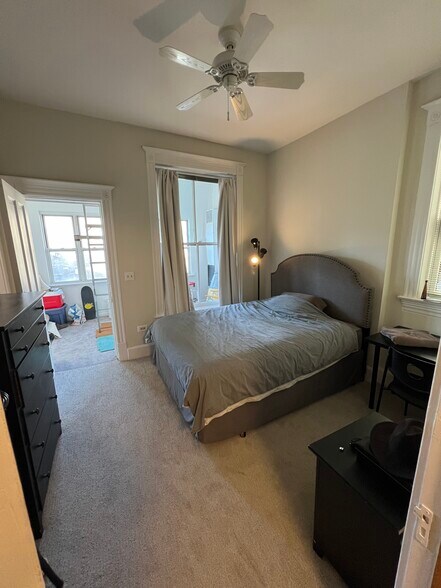 Second bedroom with queen size bed, walks out to indoor sunroom - 938 W Newport Ave