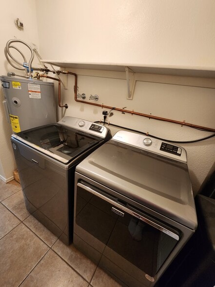 Inside air-conditioned laundry. Modern clothes washer and dryer. - 5050 N 81st St