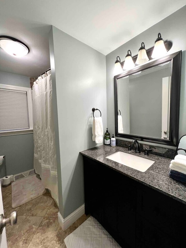 Upstairs bathroom with a bathtub and shower. - 1237 Giesse Dr