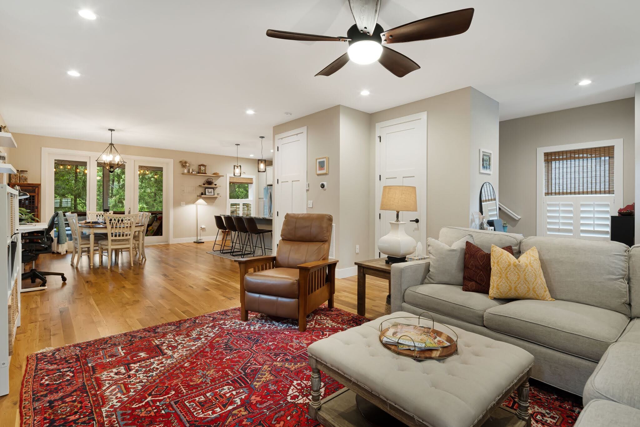 Living room facing the dining area and open-concept kitchen. - 33 Rex Dr