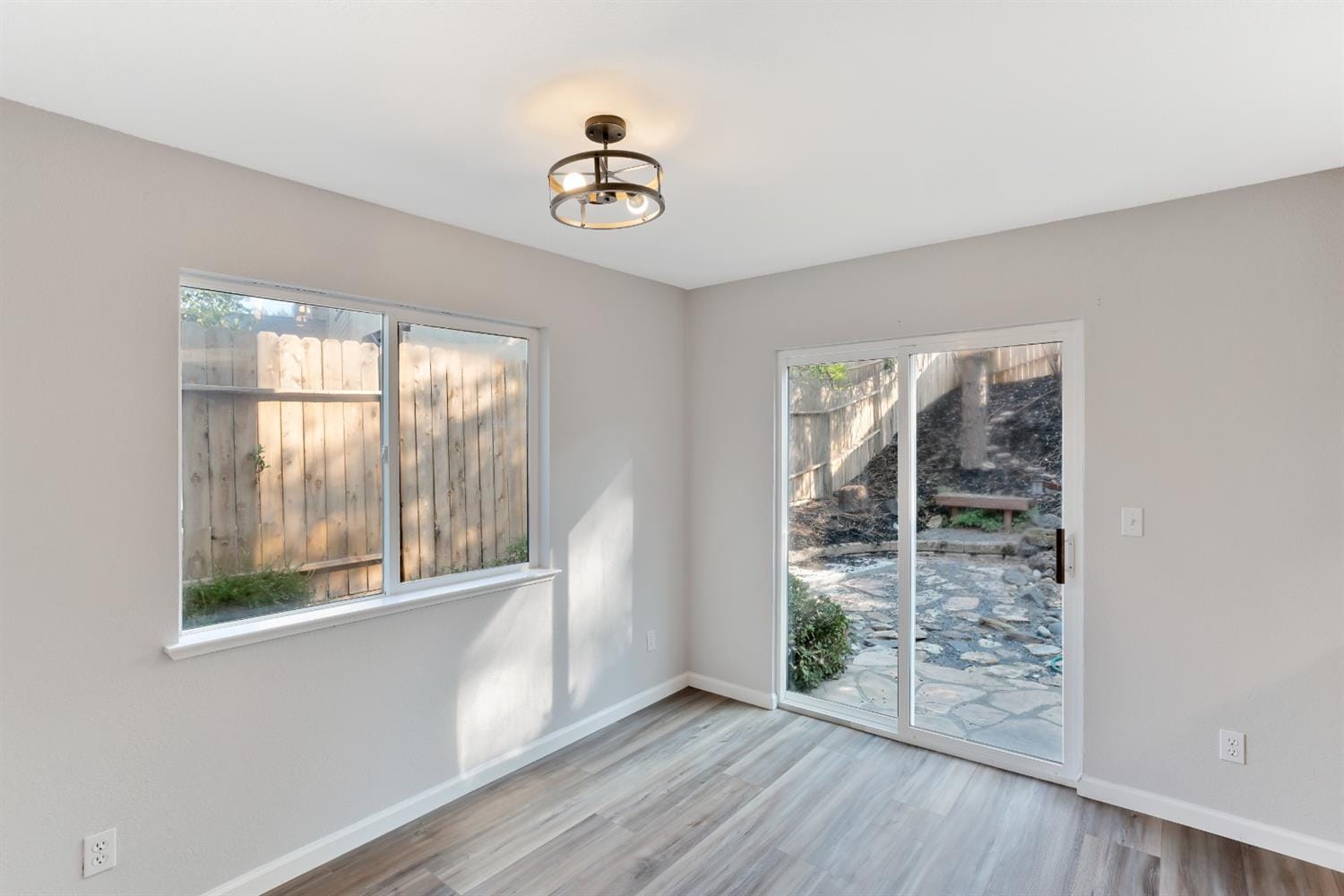 The view of the backyard from the dining room. - 3038 Courtside Dr