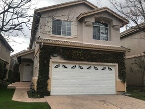 Building Photo - Located on a cul-de-sac, within the gated ...
