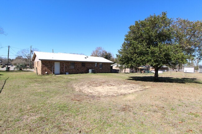 Building Photo - Charming 3-Bedroom Brick Home on Half an A...