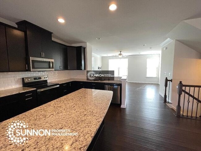 Building Photo - Beautiful 3-story End Unit in City Park!
