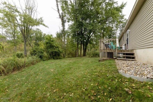 Building Photo - Spacious 3BR Duplex with Finished Basement & 2-Car Garage in Otsego