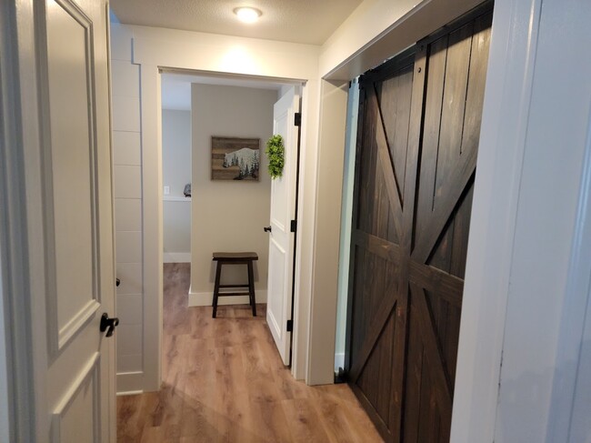 Lower level, hall between bedrooms, and door to family room - 2836 Sleepy Hollow Rd