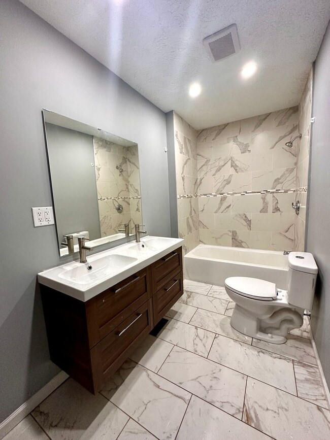 Building Photo - DEPOSIT MOVES YOU IN! No rent due until Au...