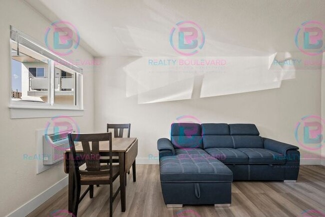 Building Photo - Studio apartment available now in the hear...