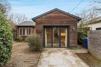 Building Photo - Beautiful, modern 4-bdrm/2-bath home in Concordia—Private, urban sanctuary w/ flex spaces