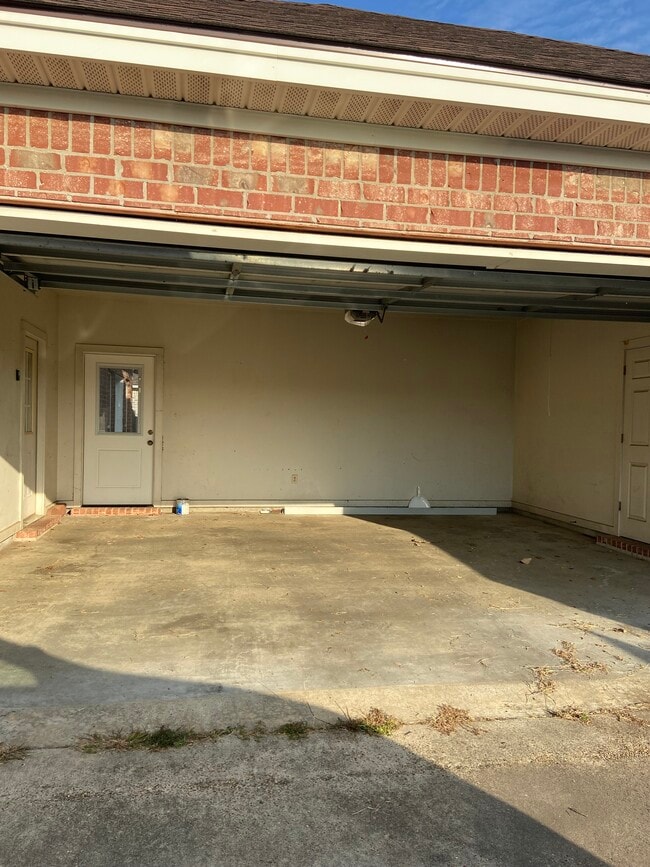 2 car garage with remote control and storage room. Accessible attic for storage - 308 Thatcher Ln