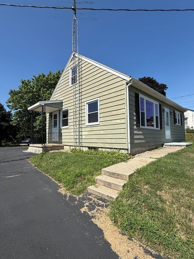Building Photo - Charming 4-Bedroom Cape Cod Home with Spacious Yard & Storage