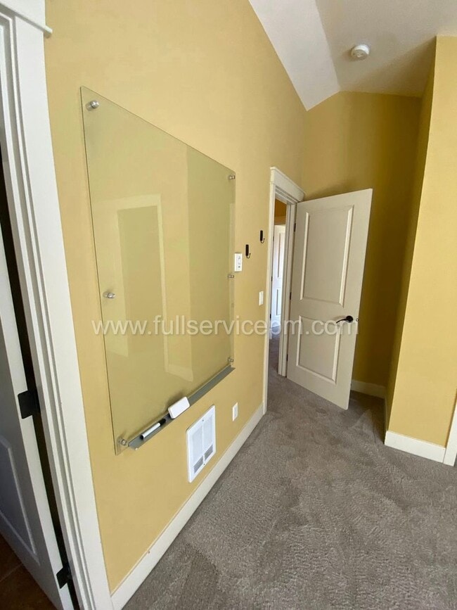 Building Photo - Spacious townhome with private backyard, garage parking, multiple decks, and a dedicated home off...