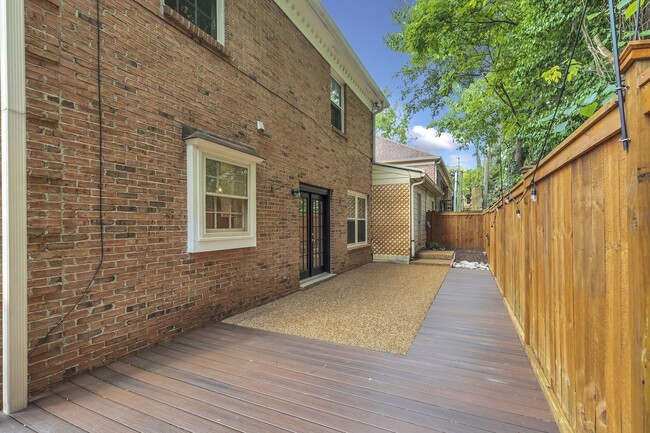 No maintenance composite deck material on patio. Access to the garage is off the patio. - 153B Woodmont Blvd