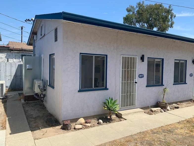 1877 on left side of building - 1877 Gardenia Ave