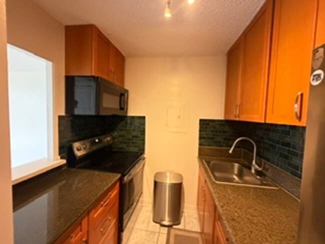 Building Photo - Welcome to your new home at Pearlridge Gardens & Tower! This 1-bedroom, 1-bathroom condo $2,100