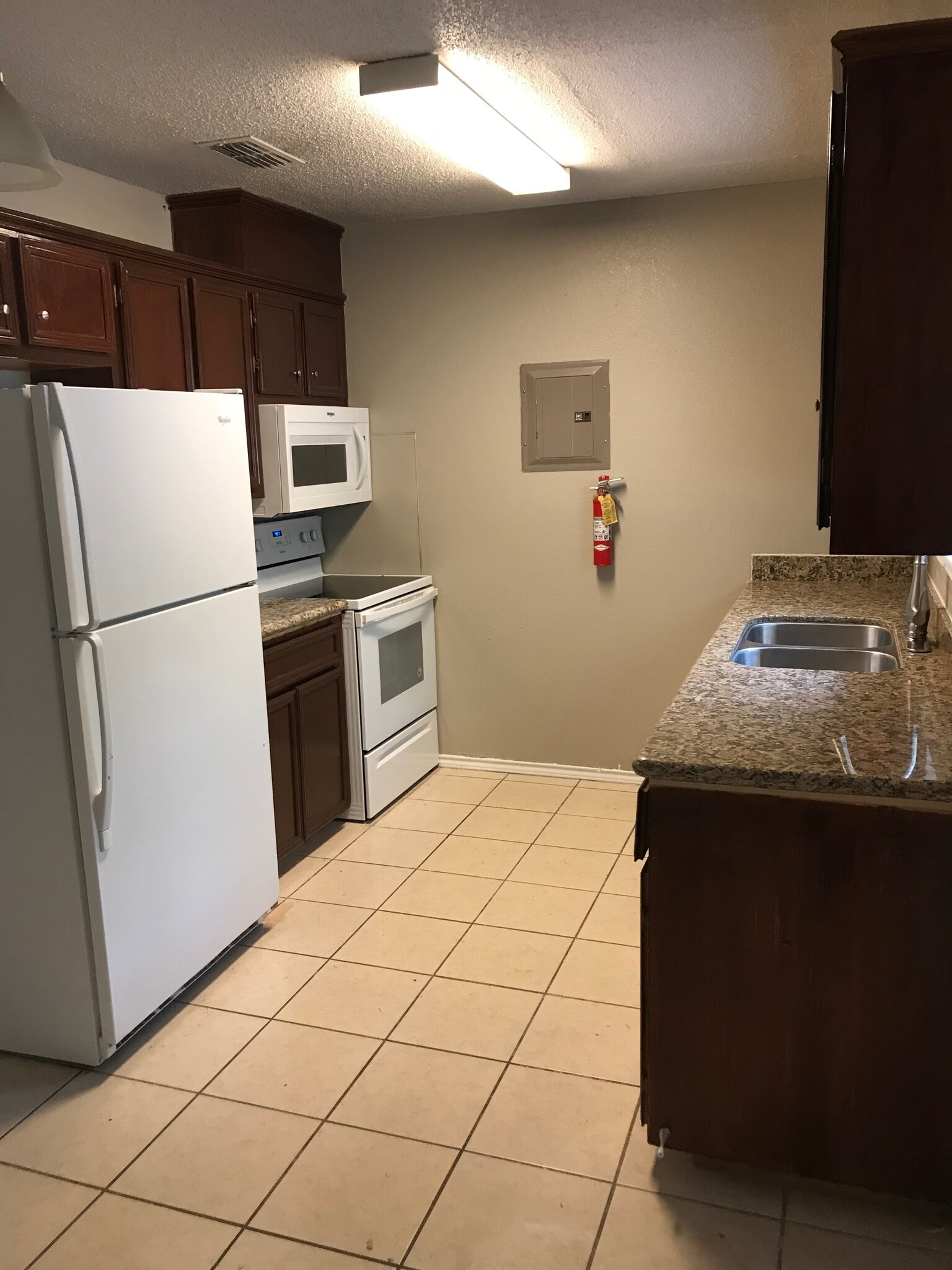 Newly remodeled kitchen with built in microwave, refrigerator, dishwasher, and stove. - 1801 Lexington Circle