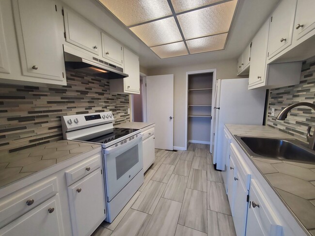 Building Photo - Private 2x2 Santa Rosa Townhouse with pool, 2-car garage, workshop area, fireplace, W/D Hookups