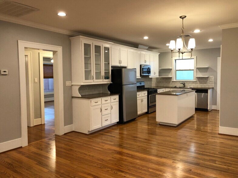 Large kitchen made for entertaining! Hallway shown to both bedrooms and bathroom - 1712 Blodgett St