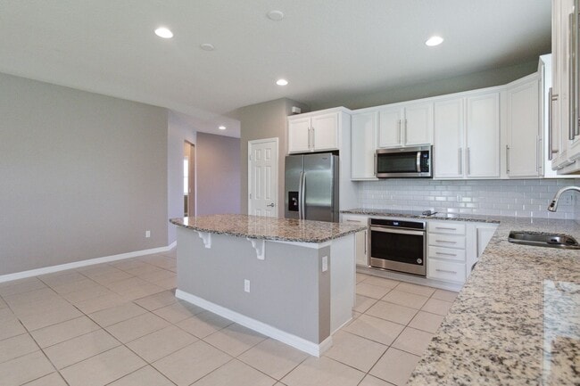 Building Photo - MOVE IN SPECIAL-Gorgeous Energy Efficient 4/2 Home in Gated Community Close to Lake Nona