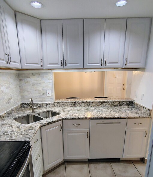 View from Kitchen towards DR and entry door - 1353 Pine Ridge Cir E