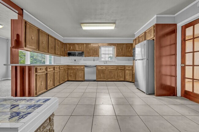 Building Photo - spacious 4-bedroom, 2.5-bath home featuring a 2-car garage and fresh updates throughout.