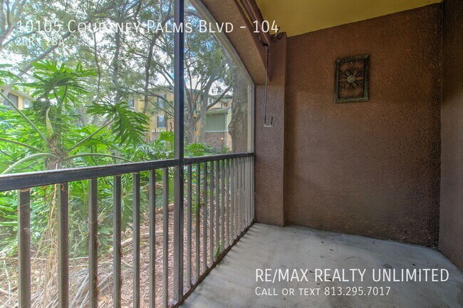 Building Photo - 10105 Courtney Palms Blvd