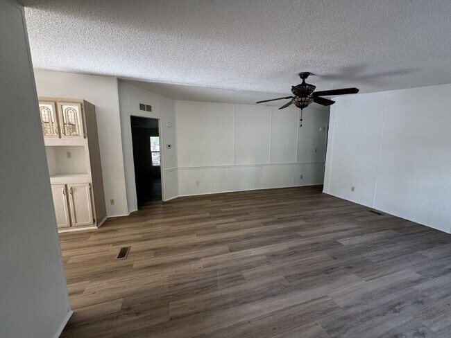 Building Photo - 3 bed 2 bath on one acre lot. New vinyl flooring throughout.