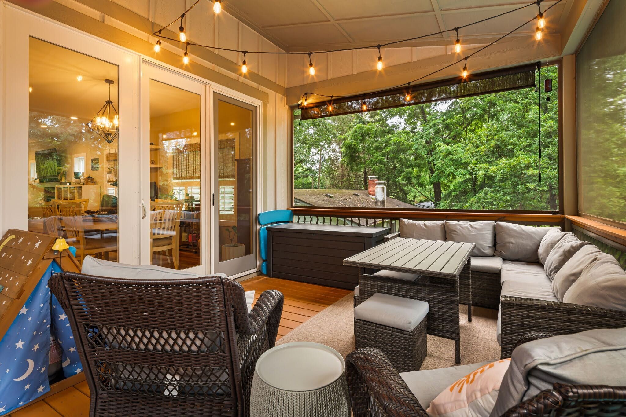 Outdoor living space in screened-in back porch. - 33 Rex Dr