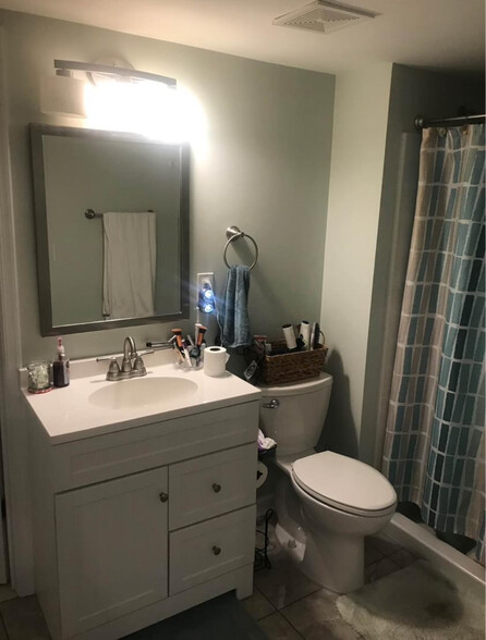 Full bathroom with walk in shower and walk in closet - 2039 Coast Guard Dr