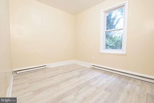 Building Photo - 7022 Woodland Ave
