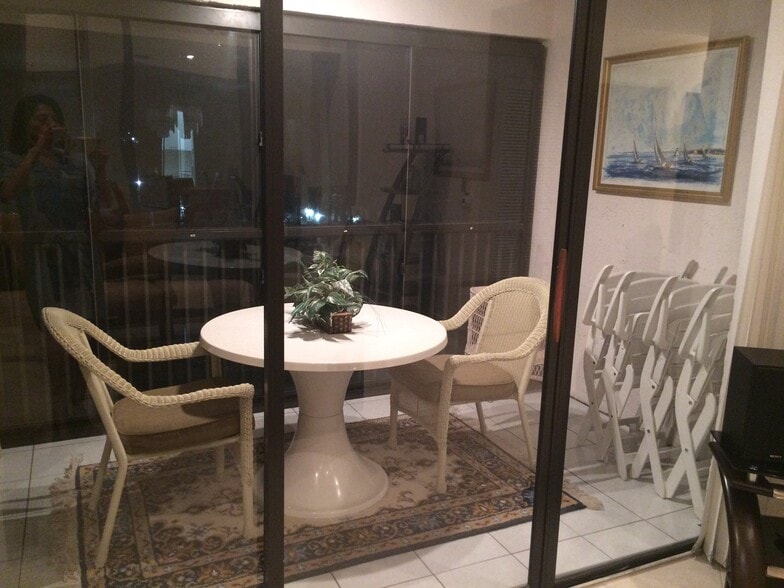 Glass enclosed patio overlooking pond - 5265 Brisata Circle