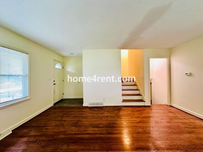 Building Photo - Olathe Duplex w/ Wood Floors, Finished Basement, and a Fenced Yard!