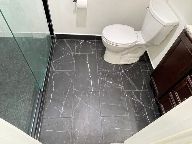 New bathroom tile - 125 E 1st Ave