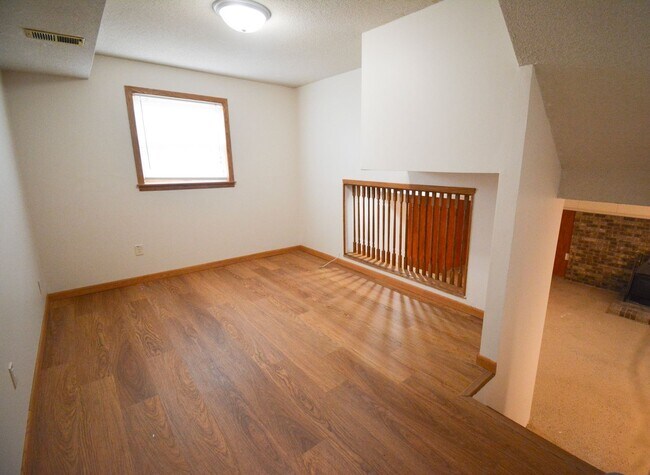 Building Photo - Beautiful multi-level with Gorgeous Yard and LOTS of Storage!