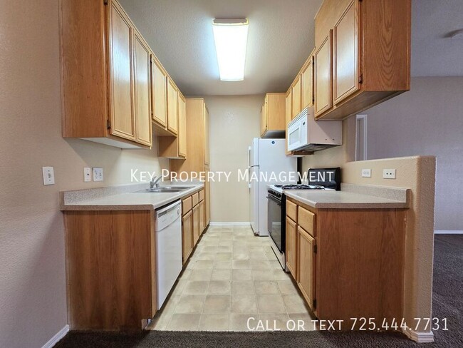 Building Photo - 2 BR CONDO IN GATED COMMUNITY W/ POOL AND ...