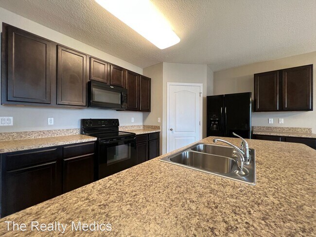 Building Photo - 4 br, 2 bath House - 1665 Laurel Oaks Dr