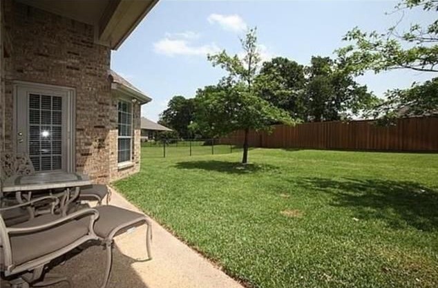 Covered patio leading to the backyard. - 1810 Manchester Way