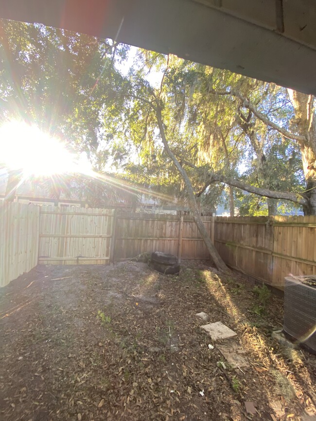 Fully fenced backyard with shade trees - 2858 Wonderwood Ln