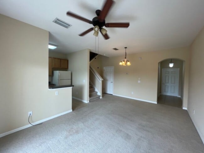 Building Photo - Spacious Gated Townhouse with Garage, Community Pool, and More!